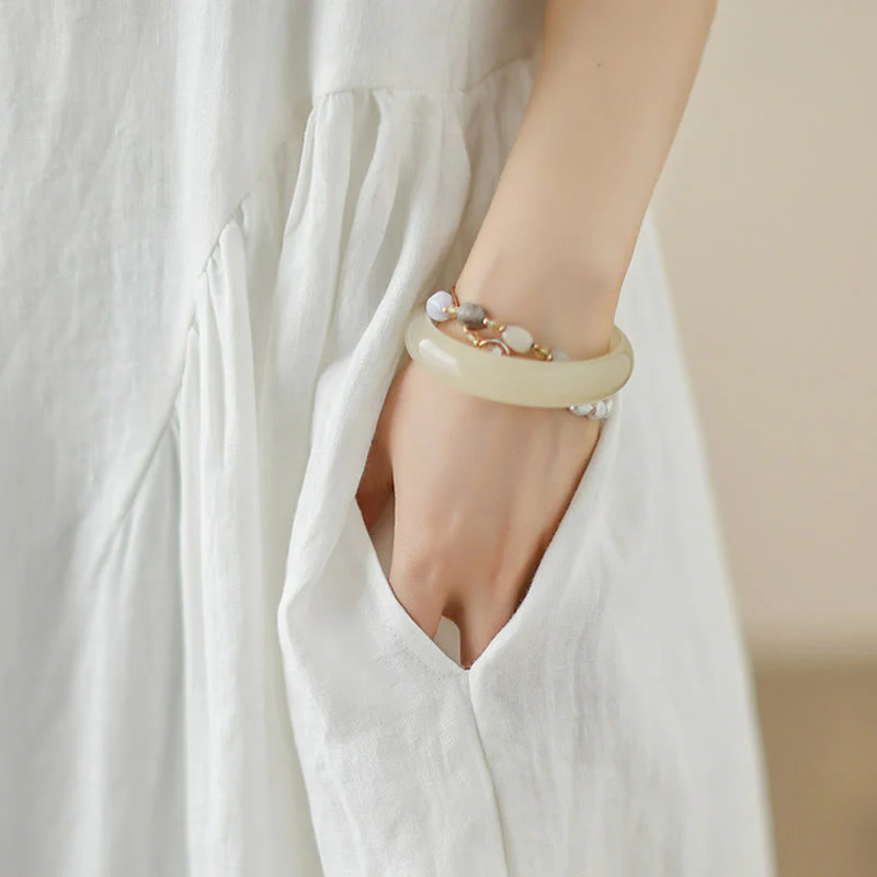 Abito midi in cotone senza maniche con tasche, motivo floreale bianco casual con bottoni sul retro Buddha Stones - Image 9