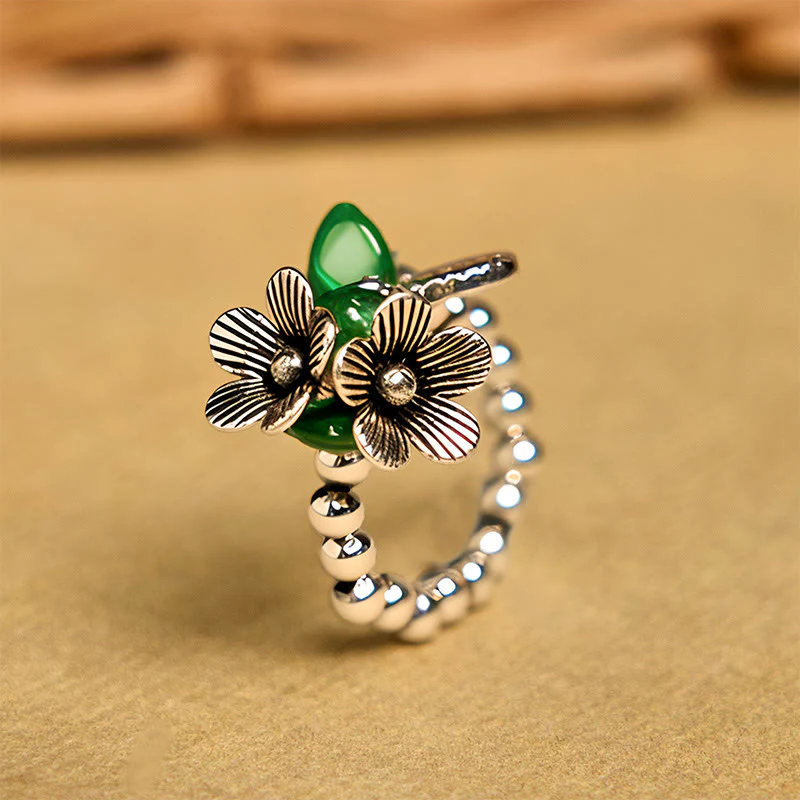 Anello elastico portafortuna in lega di rame con motivo floreale e Buddha Stones