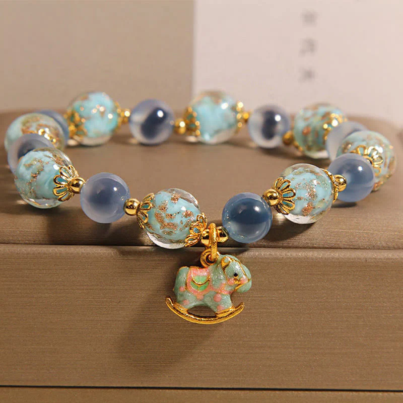 Bracciale Buddha Stones in agata naturale color caramella e cristallo bianco per l'anno del cavallo