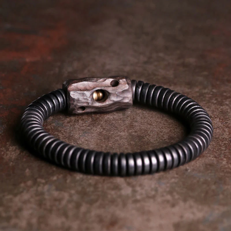 Bracciale Buddha Stones in legno di ebano, rame e ottone con fori per l'equilibrio
