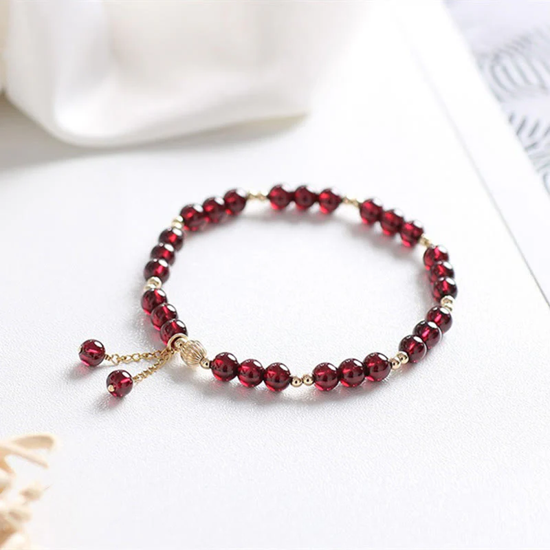 Bracciale Buddha Stones in lega placcata oro 14K con granato naturale e calma