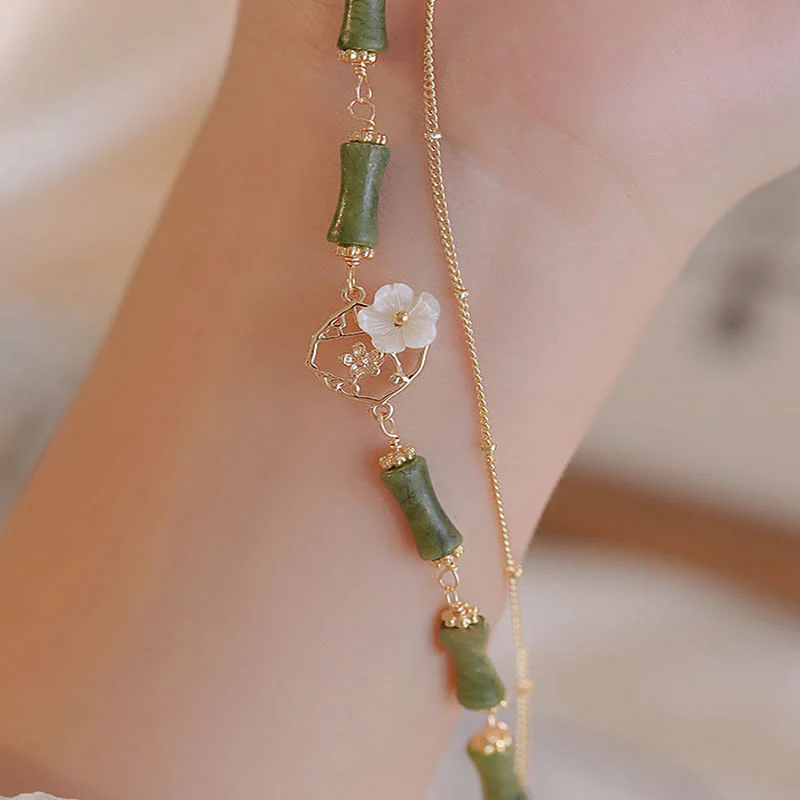 Bracciale Buddha Stones in rame placcato oro 14k con fiore di bambù, peridoto e doppio strato di ricchezza - Image 6