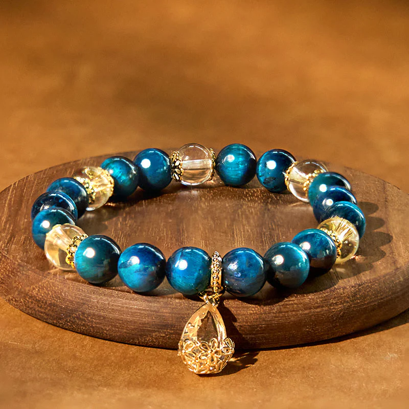 Bracciale Buddha Stones Occhio di Tigre Blu Cristallo Bianco Goccia d'Acqua Forza - Image 2