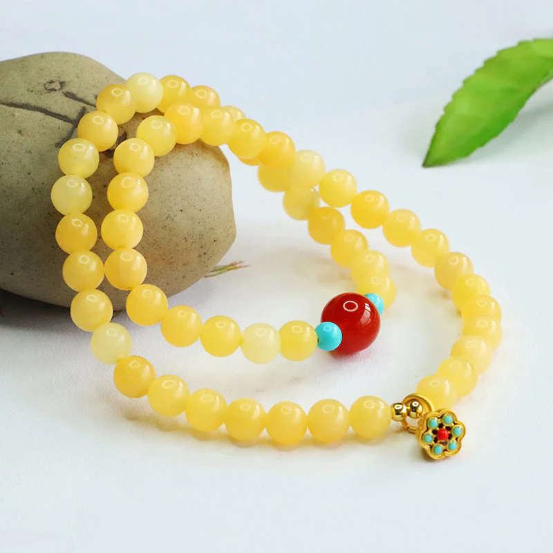 Bracciale della fortuna con perline di agata rossa e topazio Buddha Stones