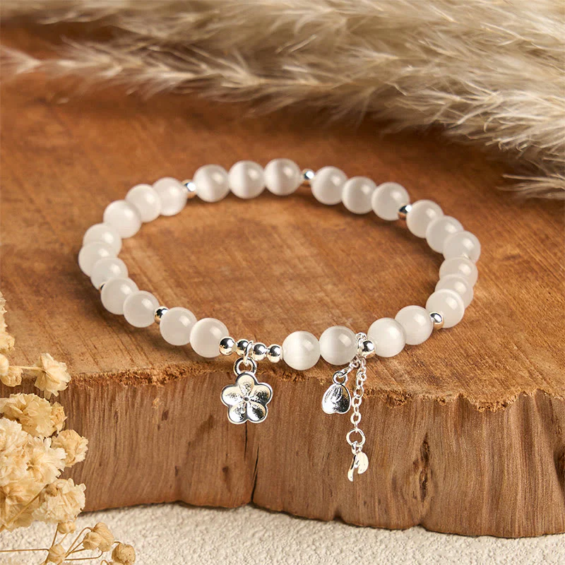 Bracciale della pace con fiori di ciliegio e occhio di gatto naturale Buddha Stones