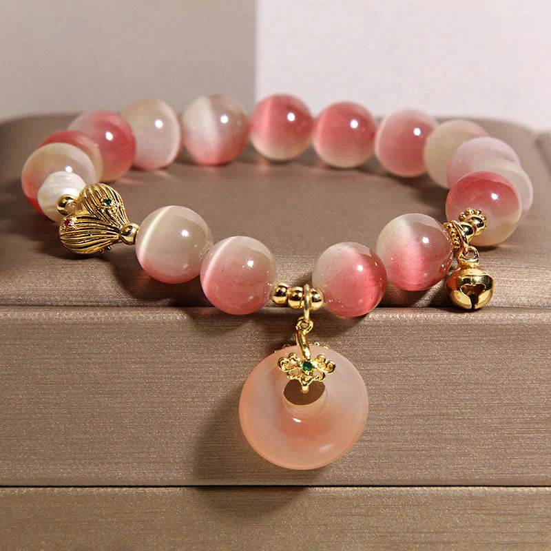 Bracciale della pace in agata Yanyuan con occhio di gatto rosa sfumato e fibbia naturale della pace Buddha Stones