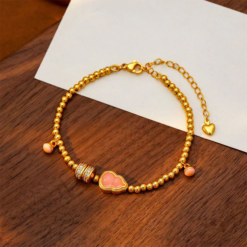 Bracciale della ricchezza con perline di zucca placcate in rame e ottone Buddha Stones - Image 4