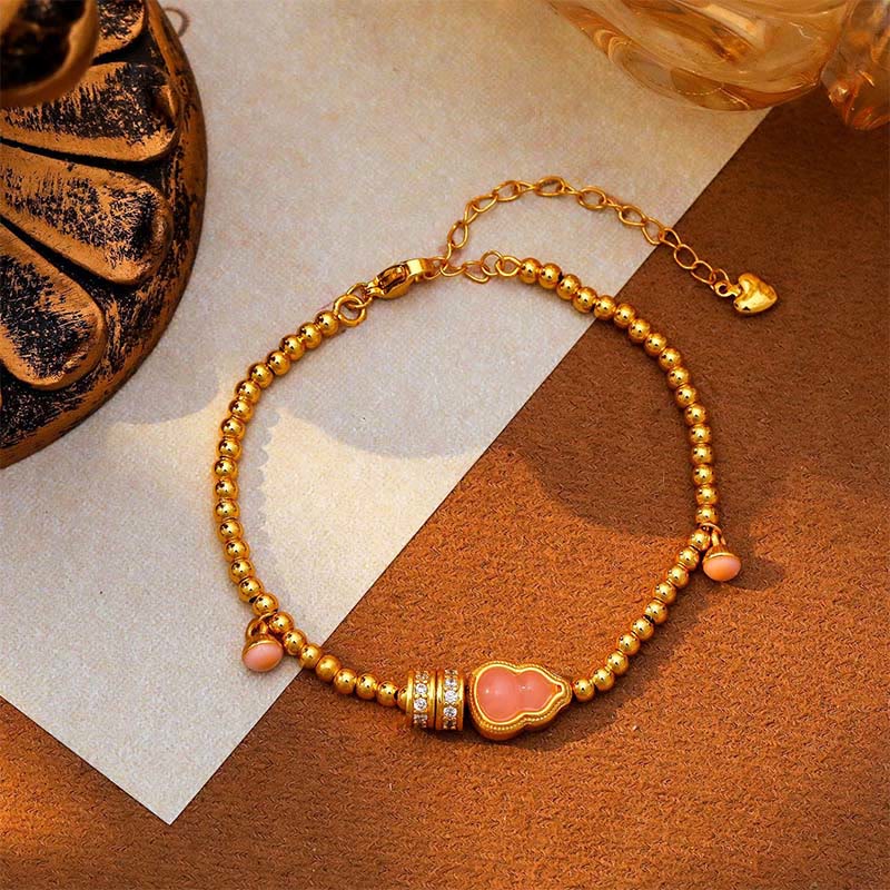 Bracciale della ricchezza con perline di zucca placcate in rame e ottone Buddha Stones - Image 5