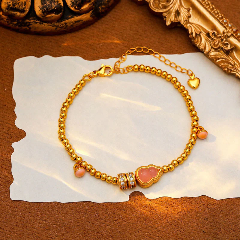 Bracciale della ricchezza con perline di zucca placcate in rame e ottone Buddha Stones - Image 8