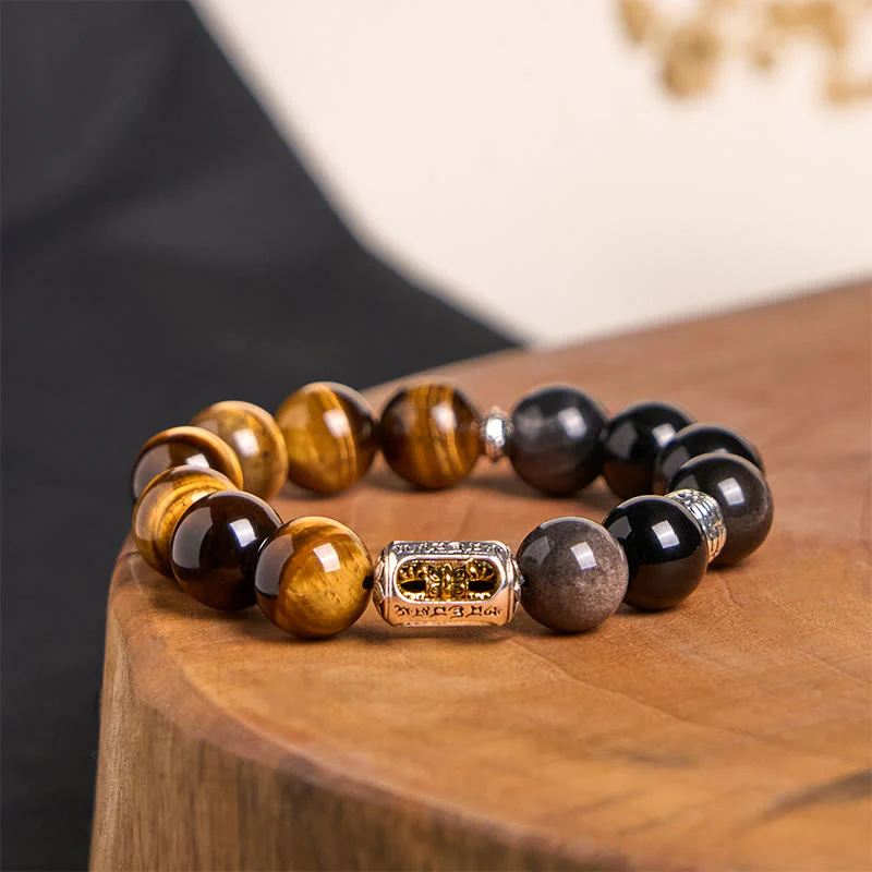 Bracciale di protezione Vajra in ossidiana naturale con occhio di tigre e argento lucido Buddha Stones