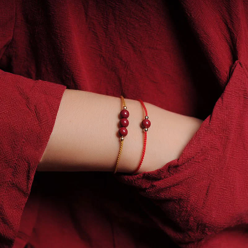 Bracciale intrecciato con corda di benedizione in cinabro naturale placcato oro 14K Buddha Stones - Image 17
