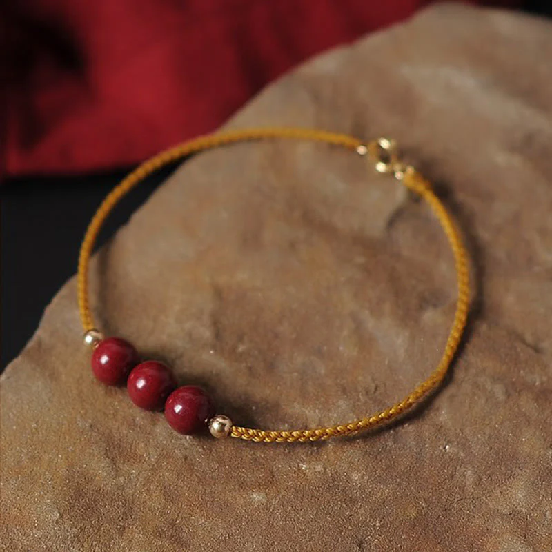Bracciale intrecciato con corda di benedizione in cinabro naturale placcato oro 14K Buddha Stones - Image 2