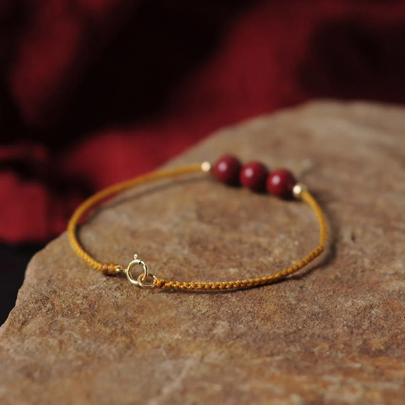 Bracciale intrecciato con corda di benedizione in cinabro naturale placcato oro 14K Buddha Stones - Image 5