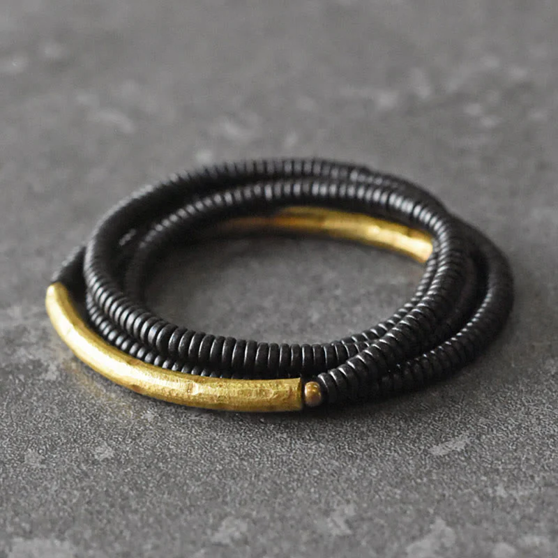 Bracciale multistrato in ottone, rame e legno di ebano Buddha Stones