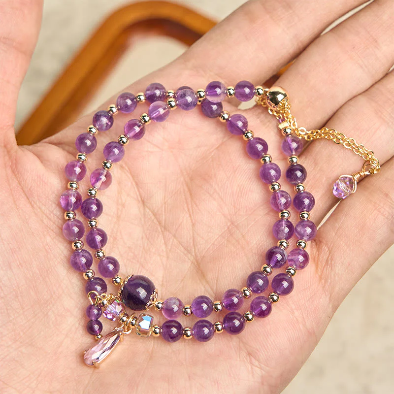 Bracciale multistrato in perle di ametista naturale Buddha Stones - Image 2