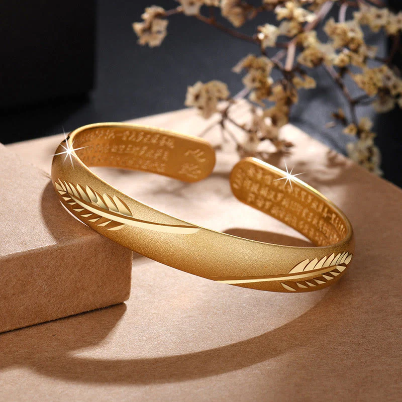 Bracciale rigido in rame con motivo inciso a forma di cuore con piume Buddha Stones, modello Wealth