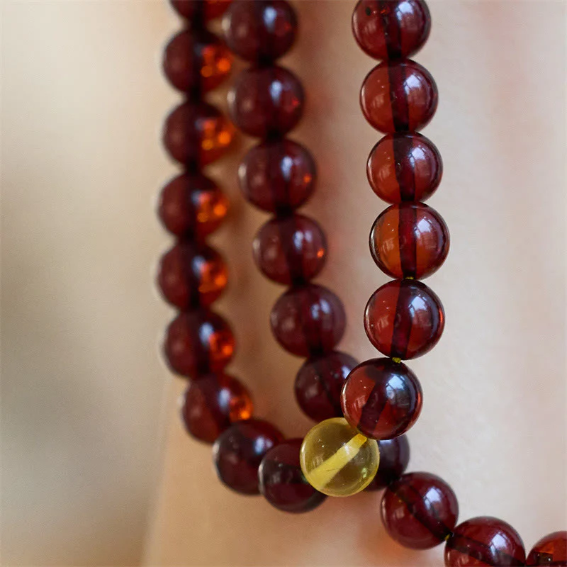 Braccialetto anti-ansia in ambra trasparente con 108 perle di Mala naturali Buddha Stones - Image 4