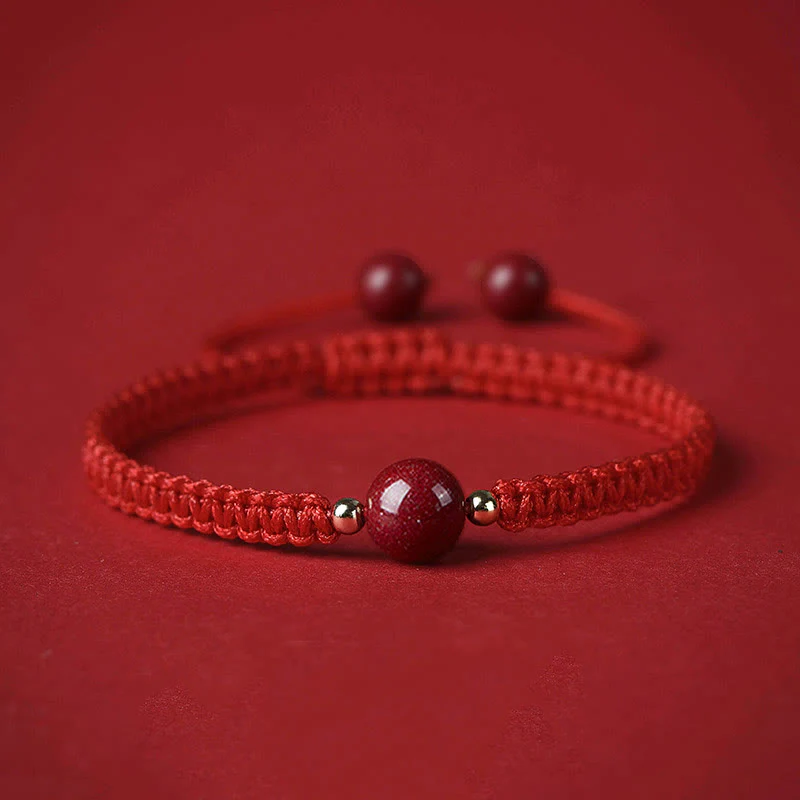 Braccialetto con cordino rosso e perline di cinabro fortunato Buddha Stones