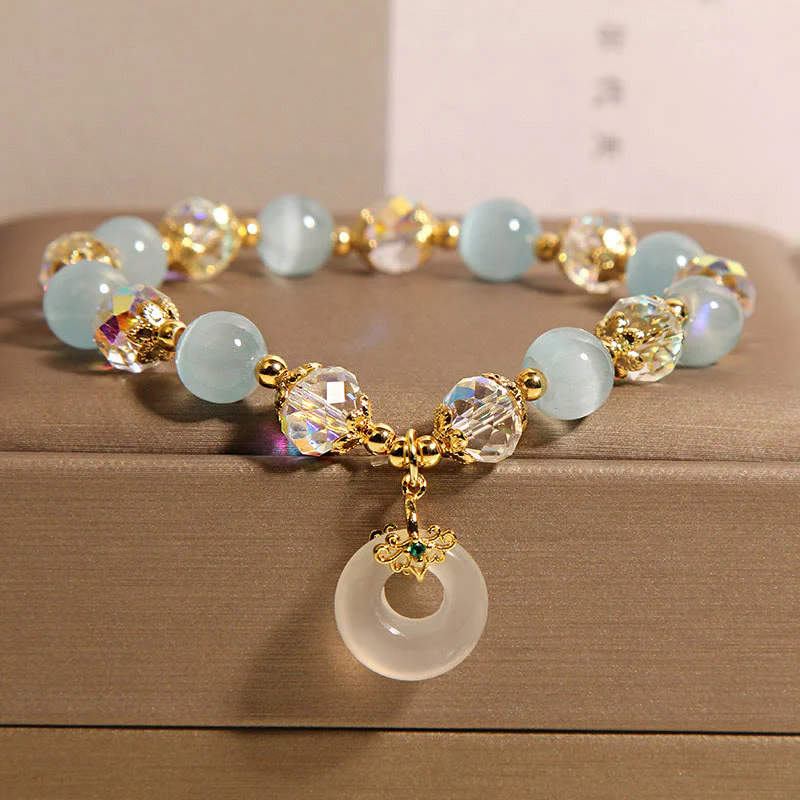 Braccialetto dell'equilibrio con fibbia della pace in cristallo bianco e Buddha Stones blu occhio di gatto