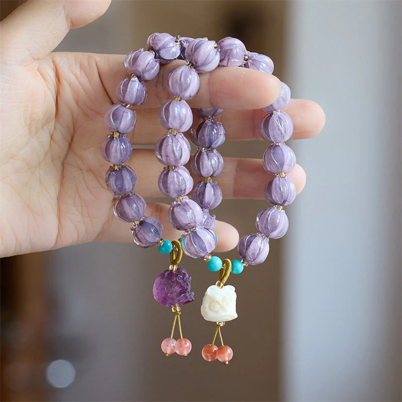 Braccialetto dell'illuminazione con ciondolo leone danzante avorio, perline di vetro Liuli, motivo loto, fluorite e Buddha Stones - Image 2