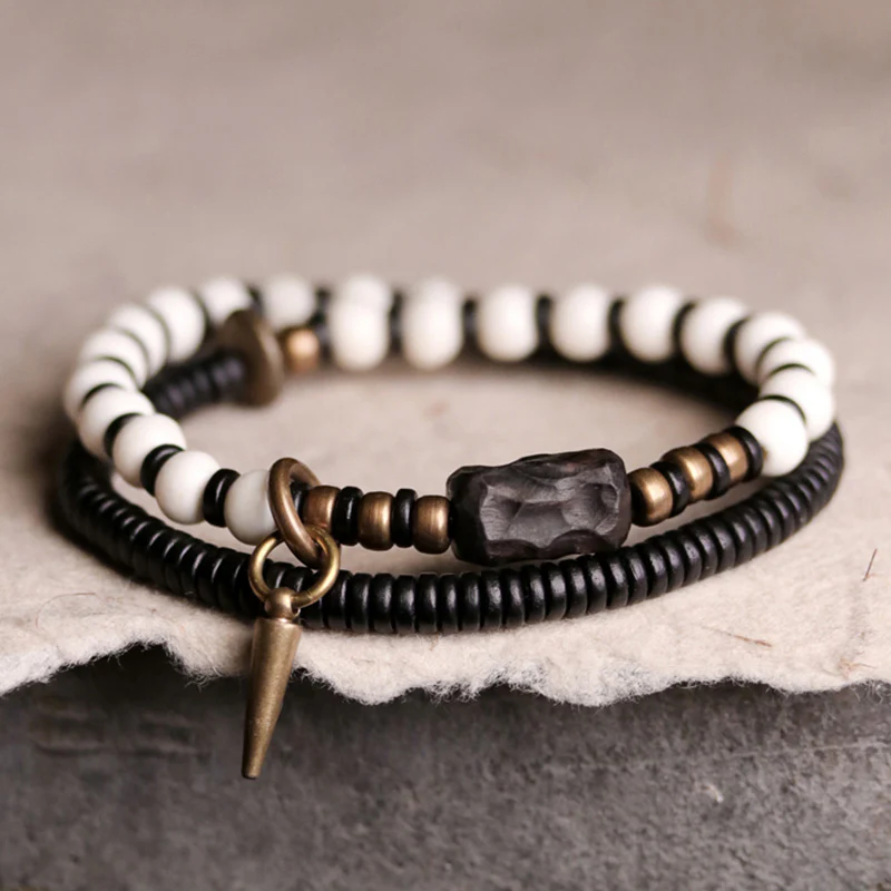 Braccialetto di coppia con perline di osso, ebano, Buddha Stones e rame