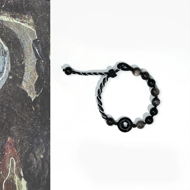 Braccialetto di corda nera purificante con fibbia della pace in ossidiana nera naturale Buddha Stones
