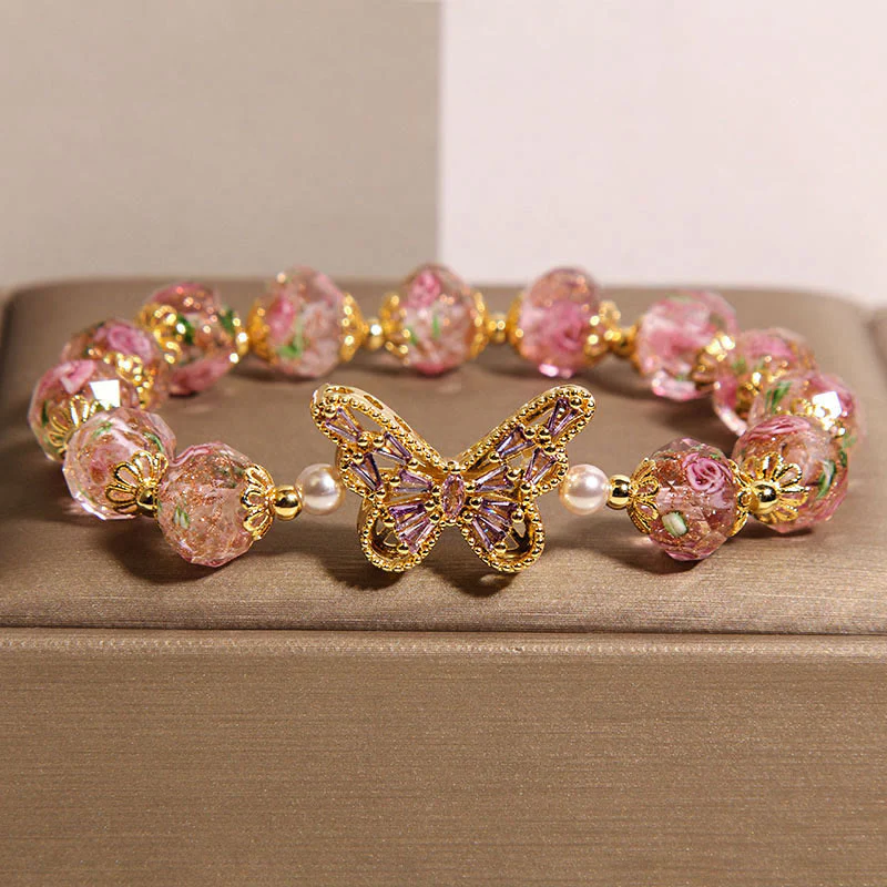Braccialetto di cristallo rosa con motivo a farfalla naturale Buddha Stones