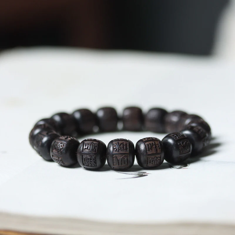 Braccialetto di equilibrio inciso in legno di Buddha Stones tibetano Om Mani Padme Hum