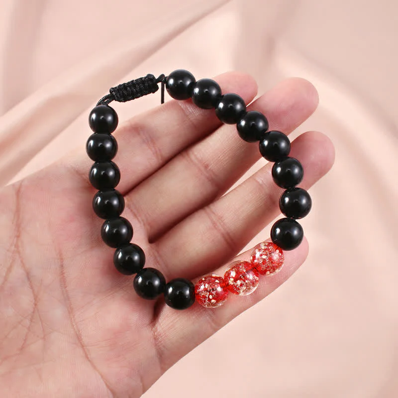 Braccialetto di forza in pietra luminosa con ossidiana nera Buddha Stones - Image 10
