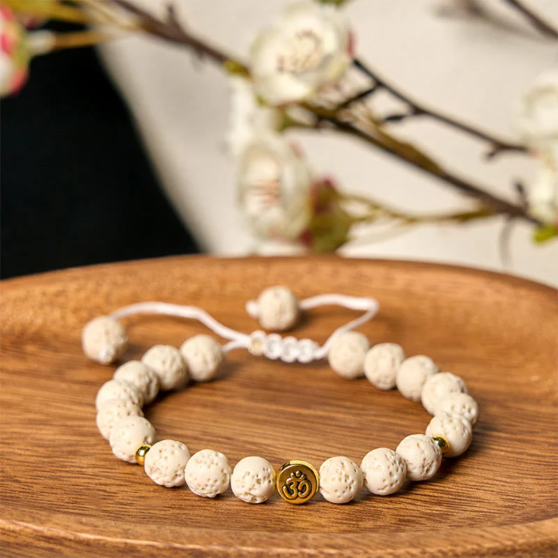 Braccialetto di guarigione calma con simbolo Om e pietre di lava bianca Buddha Stones