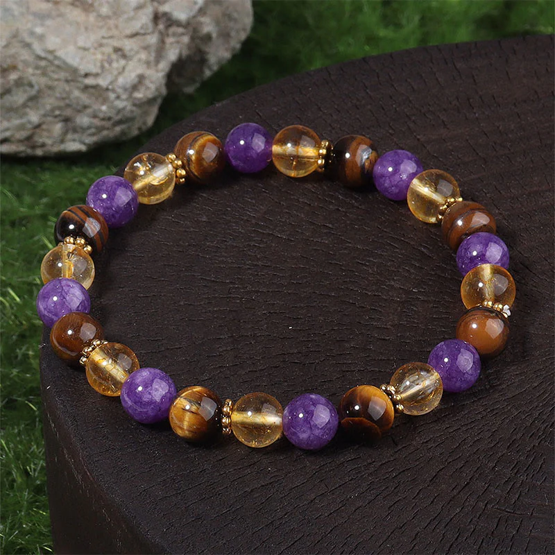 Braccialetto di guarigione con perline distanziatrici in Buddha Stones, ametista, occhio di tigre e citrino