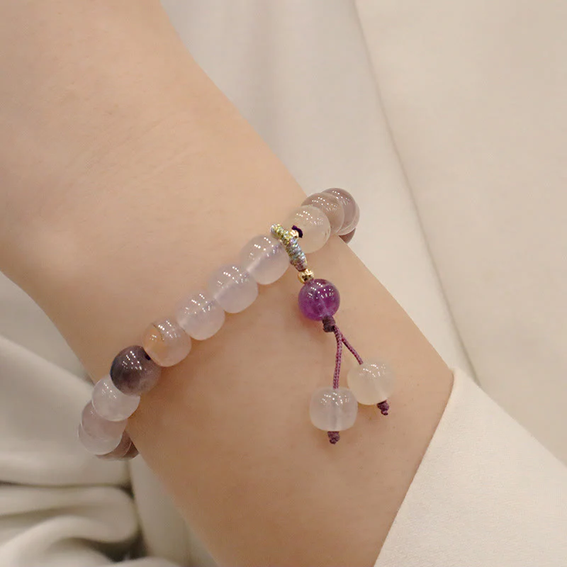 Braccialetto di perline con ciondolo a forma di fiore viola dorato naturale di seta Buddha Stones - Image 10