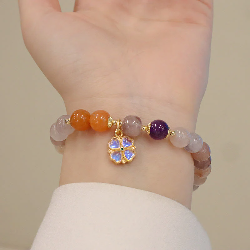 Braccialetto di perline con ciondolo a forma di fiore viola dorato naturale di seta Buddha Stones - Image 3