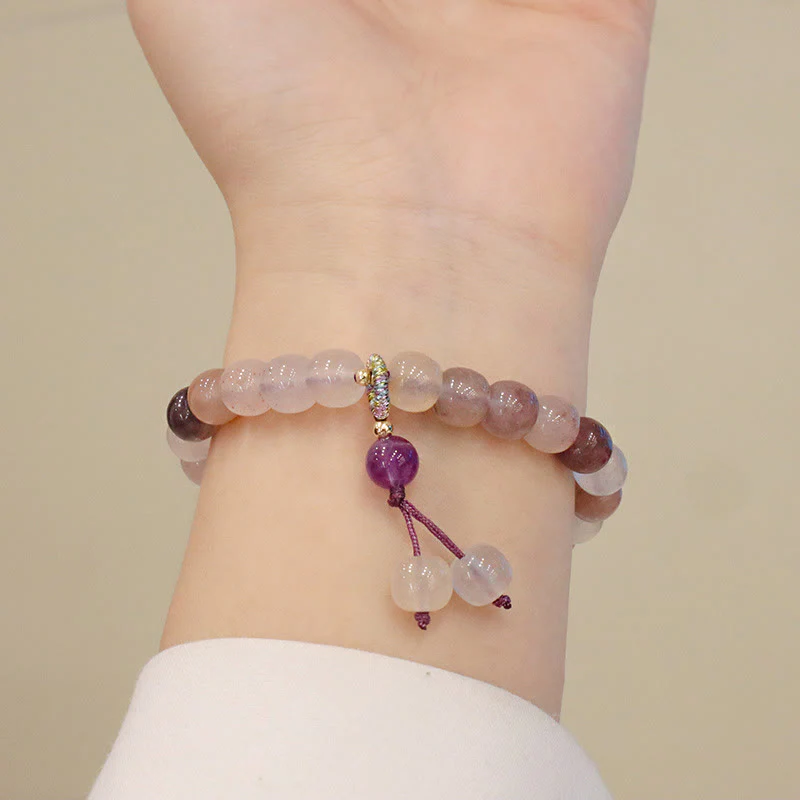 Braccialetto di perline con ciondolo a forma di fiore viola dorato naturale di seta Buddha Stones - Image 8