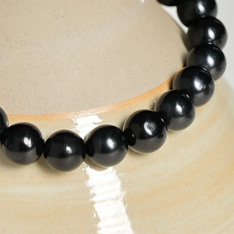 Braccialetto di perline con forza interiore in pietra di shungite autentica e rotonda Buddha Stones - Image 11