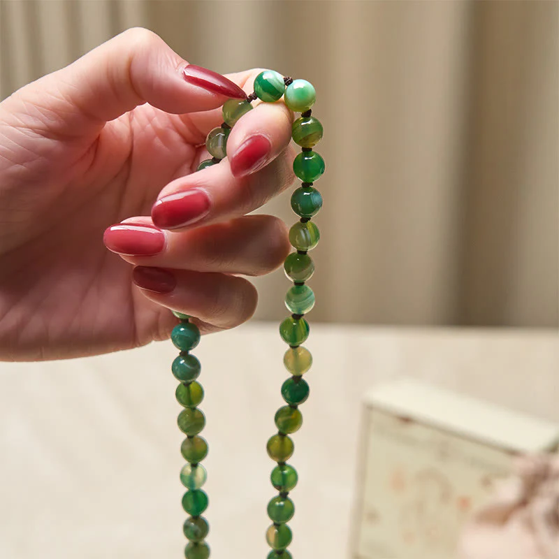 Braccialetto di protezione con Buddha Stones e nappa di malachite - Image 5