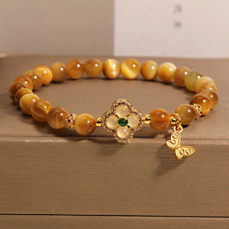 Braccialetto di protezione con farfalla a quadrifoglio e occhio di tigre Buddha Stones