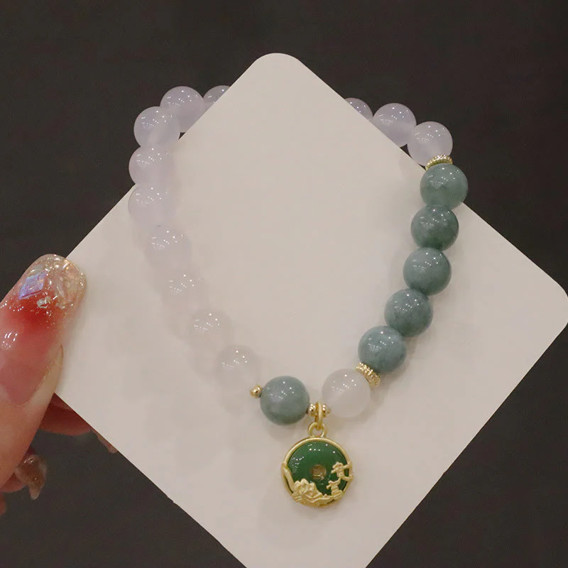 Braccialetto di protezione con fibbia della pace, fiore di loto, agata bianca e giada Buddha Stones - Image 11