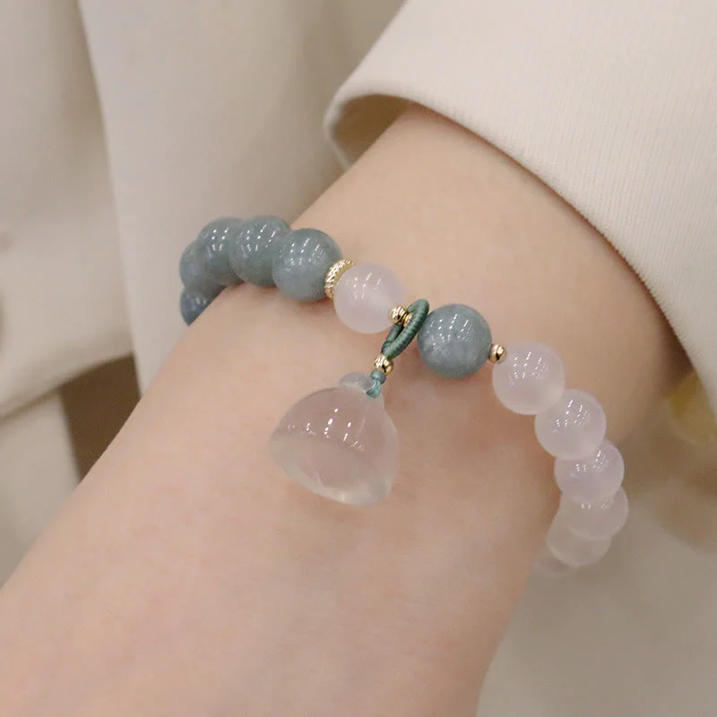 Braccialetto di protezione con fibbia della pace, fiore di loto, agata bianca e giada Buddha Stones - Image 3