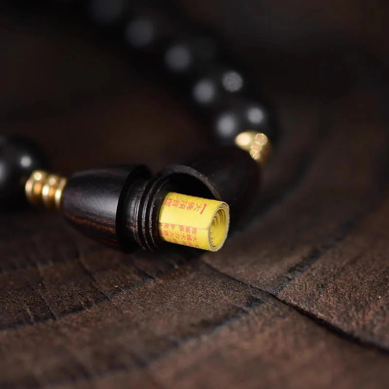 Braccialetto di protezione con perline di ebano e rotolo di Sutra con Buddha Stones - Image 9