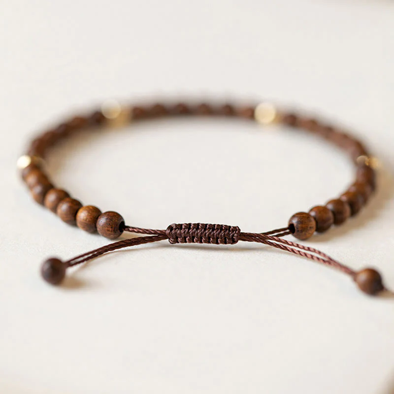 Braccialetto di protezione con perline di rame placcate in oro 14K e legno di sandalo ultrasottile da 4 mm Buddha Stones - Image 3