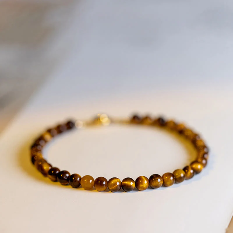 Braccialetto di protezione del coraggio in pietra naturale occhio di tigre placcato oro 14K Buddha Stones - Image 13