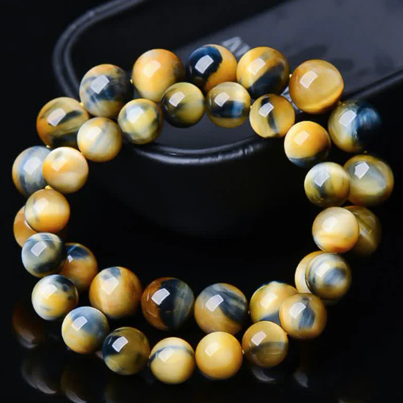 Braccialetto di protezione e forza con occhio di tigre Buddha Stones - Image 2