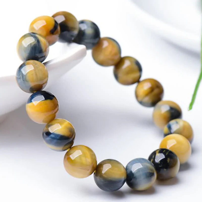 Braccialetto di protezione e forza con occhio di tigre Buddha Stones - Image 3