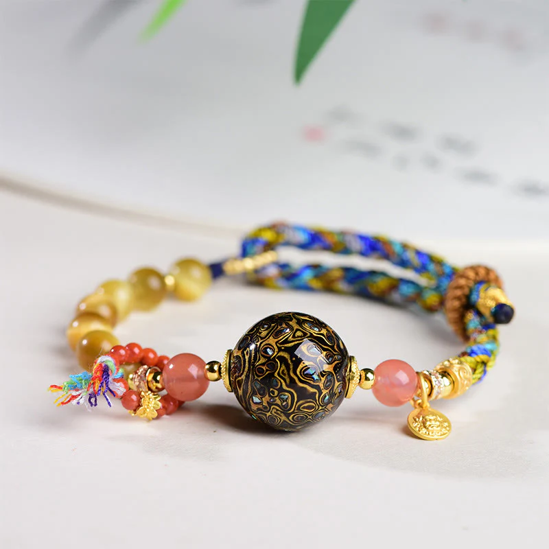 Braccialetto di protezione in pietra di occhio di tigre intrecciato a mano con perline di lacca tibetana Buddha Stones
