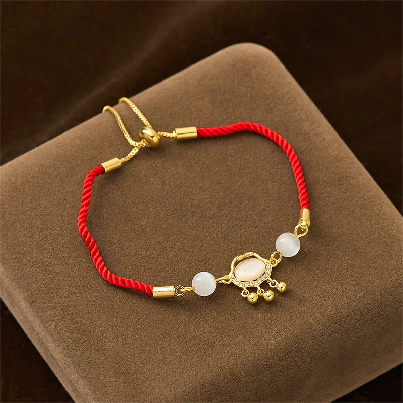 Braccialetto di protezione in rame placcato oro con ciondolo a forma di lucchetto cinese Buddha Stones filo rosso occhio di gatto - Image 2