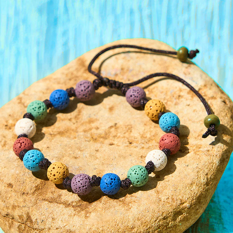 Braccialetto di supporto in pietra lavica colorata Buddha Stones