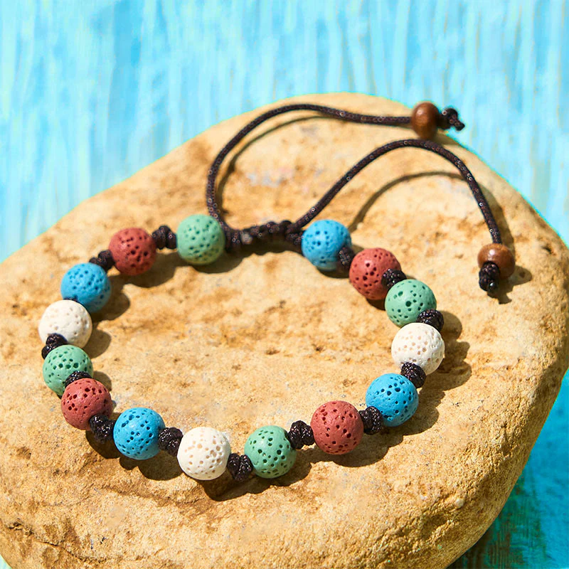Braccialetto di supporto in pietra lavica colorata Buddha Stones - Image 11