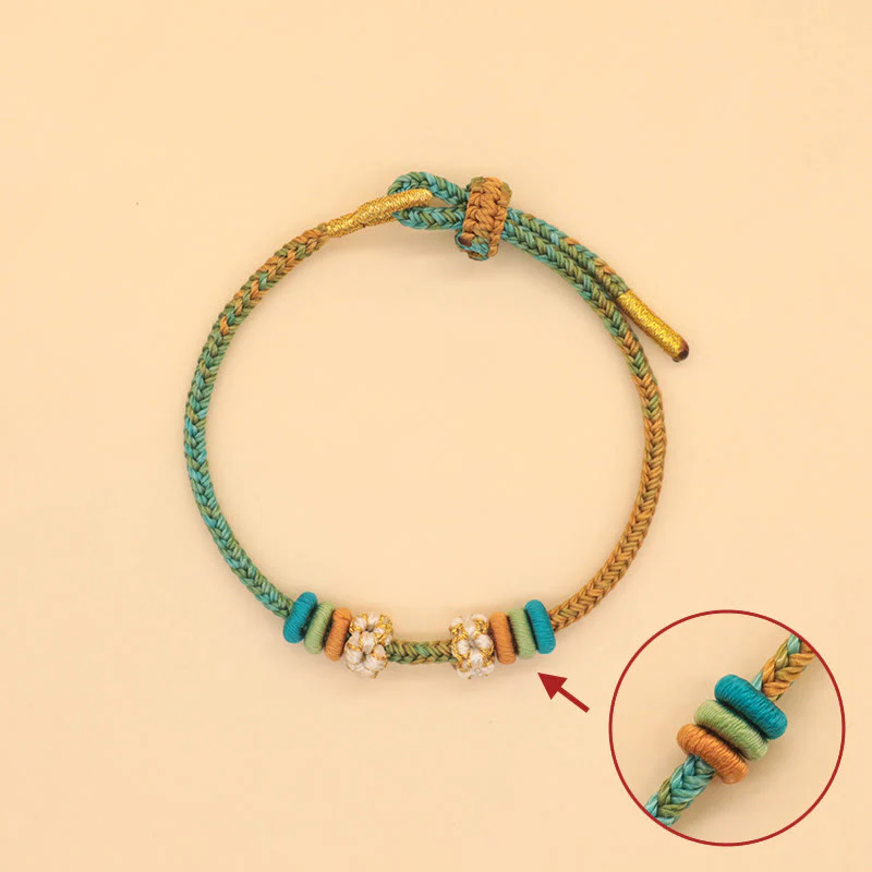 Braccialetto intrecciato con corda Buddha Stones a forma di nodo della pace a otto fili fatto a mano con nodo di fiori di pesco - Image 3