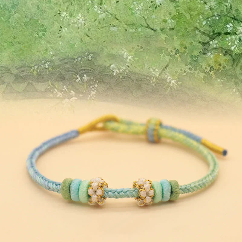Braccialetto intrecciato con corda Buddha Stones a forma di nodo della pace a otto fili fatto a mano con nodo di fiori di pesco - Image 4